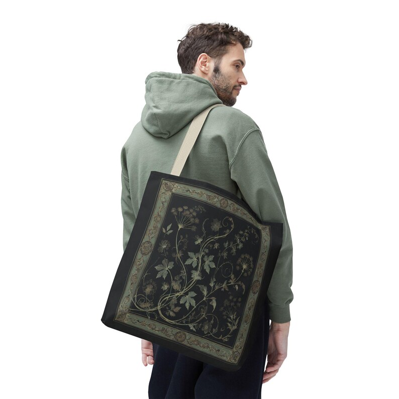 Vintage Inspired Botanical Tote Bag. A tapestry-inspired border frames olive green wildflowers and vines on black. 3 sizes, 2 strap colors.