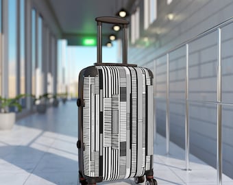 Monochrome Bars and Lines Suitcase. This bold, black and white eye-catching design will stand out on the baggage carousel.  Three sizes.