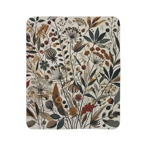 Whimsical Botanical Fleece Sherpa Blanket. Featuring an intricate design of various flowers, leaves, and branches in earthy tones. 2 sizes.