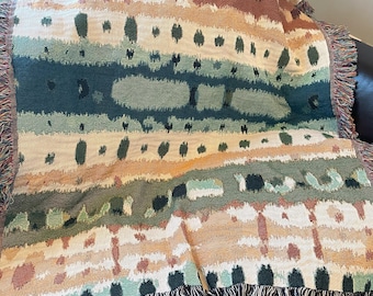 Earthy Bohemian Woven Blanket. A captivating, natural, organic pattern of earthy tones like sage green, terracotta, cream and teal.