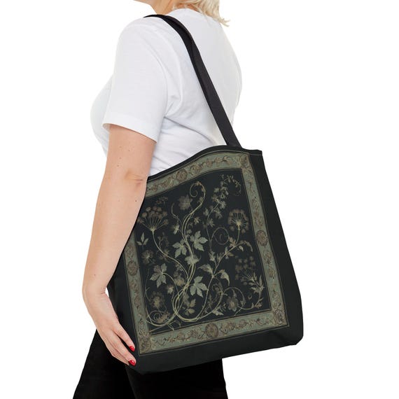 Vintage Inspired Botanical Tote Bag. A tapestry-inspired border frames olive green wildflowers and vines on black. 3 sizes, 2 strap colors.