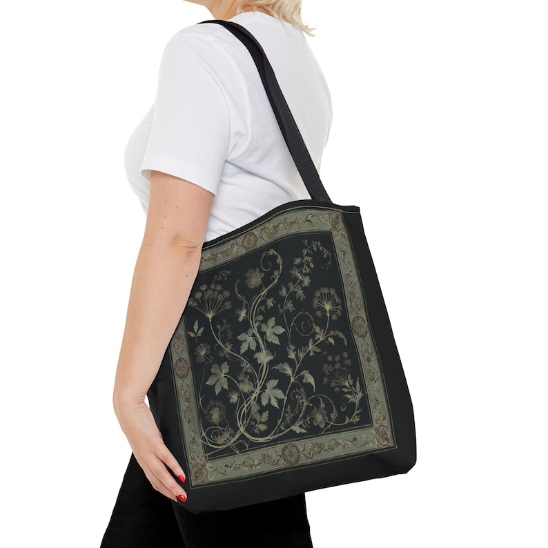 Vintage Inspired Botanical Tote Bag. A tapestry-inspired border frames olive green wildflowers and vines on black. 3 sizes, 2 strap colors.