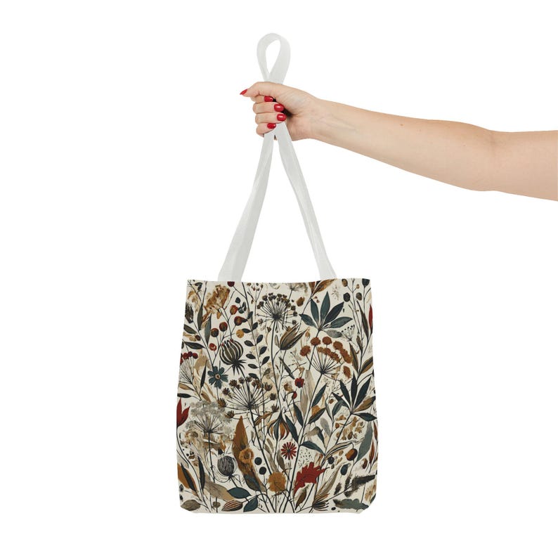 Whimsical Botanical Tote Bag. Featuring an intricate, unique and artistic design of various flowers, leaves, and branches in earthy tones.