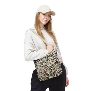 Whimsical Botanical Tote Bag. Featuring an intricate, unique and artistic design of various flowers, leaves, and branches in earthy tones.