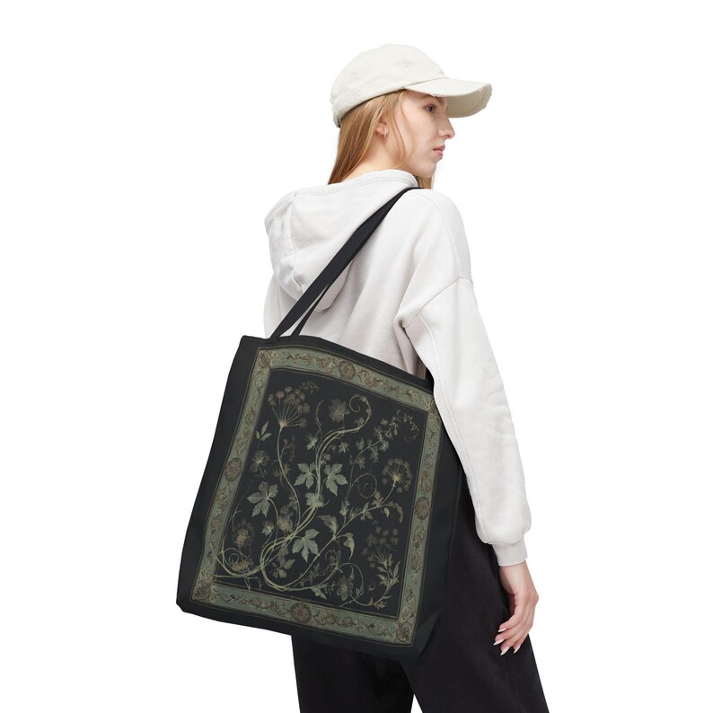 Vintage Inspired Botanical Tote Bag. A tapestry-inspired border frames olive green wildflowers and vines on black. 3 sizes, 2 strap colors.