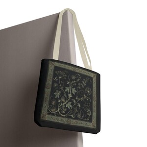 Vintage Inspired Botanical Tote Bag. A tapestry-inspired border frames olive green wildflowers and vines on black. 3 sizes, 2 strap colors.