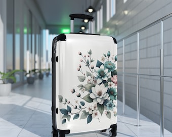 Delicate Floral Suitcase. A delicate bouquet in teal, blue, and pink on a white background evoke a sense of peace and elegance. 3 sizes.