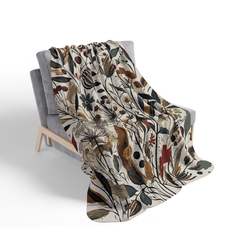 Whimsical Botanical Fleece Sherpa Blanket. Featuring an intricate design of various flowers, leaves, and branches in earthy tones. 2 sizes.