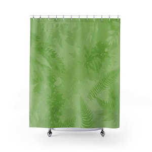 May include: Green shower curtain with a fern leaf pattern. The leaves are a lighter shade of green than the background.