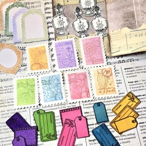 May include: A collection of decorative paper ephemera, including stamps, tags, and perfume bottle illustrations. The stamps feature floral designs and the tags have the word "Contents" printed on them. The color palette includes purple, pink, green, and yellow.