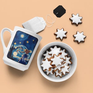 May include: A white ceramic mug with a blue and yellow anime-style illustration of a girl with blonde hair standing in front of a starry night sky. The mug is on a light orange surface with a bowl of white-frosted star-shaped cookies and a tea bag.