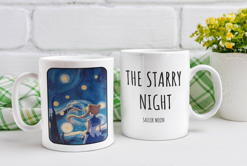 May include: Two white ceramic mugs with a black and white design. One mug features a painting of a starry night sky with a cartoon character standing in front of it. The other mug has the text "THE STARRY NIGHT" and "SAILOR MOON" printed on it.