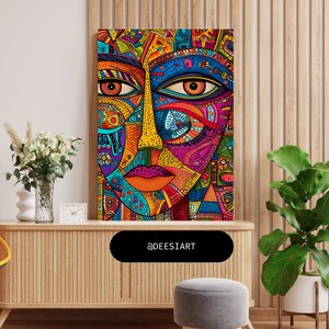 K&ouml;nnte beinhalten: Ein farbenfroher abstrakter Kunstdruck mit einem stilisierten Gesicht mit geometrischen Mustern und leuchtenden Farben, darunter Rot, Blau, Gelb, Gr&uuml;n und Pink. Der Druck ist gerahmt und h&auml;ngt an einer Wand.