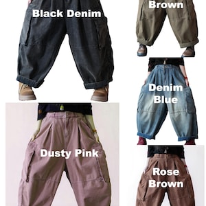 May include: A collection of five loose-fitting cargo pants in black denim, brown, denim blue, dusty pink, and rose brown. Each pair features a high waist, pleated front, side cargo pockets, and wide legs with cuffed hems. Text labels identify each color.