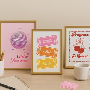 May include: Three framed prints with gold frames. One pink print features a disco ball and the text "This Girl is a Speech therapist." Another print displays three tickets that say "Speech Therapy." The third print has cherries and the text "Progress Is Sweet."