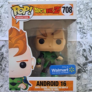 May include: A Funko Pop! vinyl figure of Android 16 from Dragon Ball Z. The figure is in a clear plastic display case. The box features the character's image, the number 708, and the Walmart logo.
