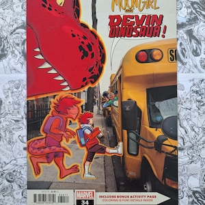 May include: Comic book cover for "Moon Girl and Devil Dinosaur" #34. The cover features a red dinosaur and two characters in front of a yellow school bus. The Marvel logo is visible, along with text that reads "Includes Bonus Activity Page".