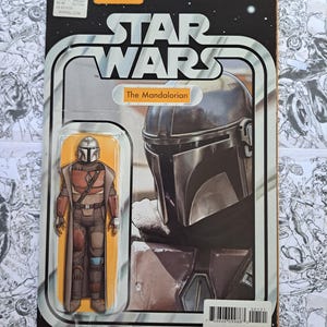 May include: A Star Wars action figure of The Mandalorian in a retro-style package. The packaging features the Star Wars logo, the Marvel logo, and an illustration of the character. The figure is in a clear plastic bubble.