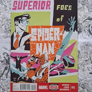 May include: Comic book cover for "The Superior Foes of Spider-Man" featuring stylized illustrations. The cover has a vibrant color scheme with the title in pink and the word "Spider-Man" in orange. The Marvel logo is visible.