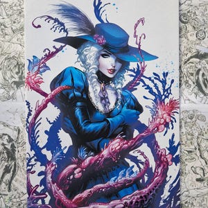 May include: Comic book cover art featuring a woman in a blue hat with a feather, blue dress, and white hair. The artwork includes purple and pink floral elements and a dark background.