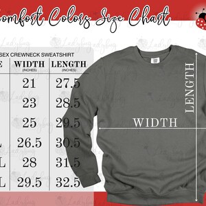 May include: A charcoal gray unisex crewneck sweatshirt displayed next to a size chart titled Comfort Colors Size Chart. The chart lists sizes S through 3XL with corresponding width and length measurements in inches, indicated by white lines.