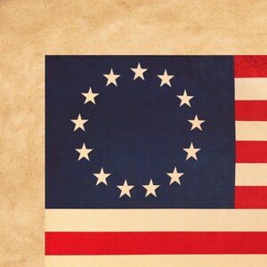 May include: A vintage American flag with a blue canton featuring a circle of 13 white stars. The flag has red and white stripes and a tan background.