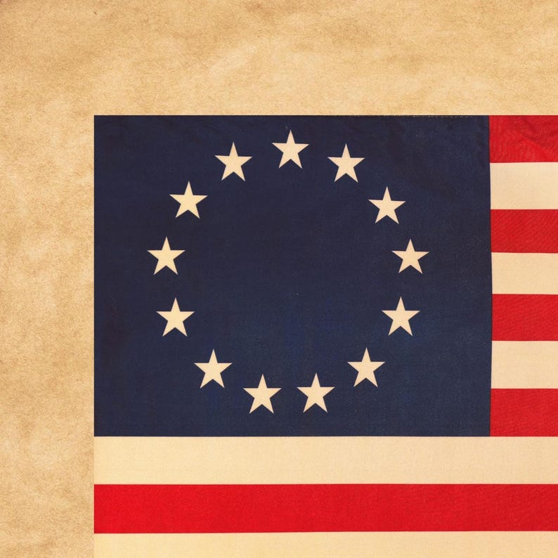 May include: A vintage American flag with a blue canton featuring a circle of 13 white stars. The flag has red and white stripes and a tan background.