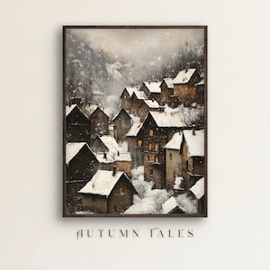 May include: A framed print depicting a snow-covered village in a mountain valley. The buildings have snow-covered roofs and lit windows, with the text "AUTUMN TALES" at the bottom.