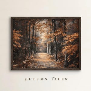 May include: A framed print depicting an autumn forest scene. The artwork features a path leading into the distance, surrounded by trees with orange and brown foliage. The words "AUTUMN TALES" are printed at the bottom of the frame.