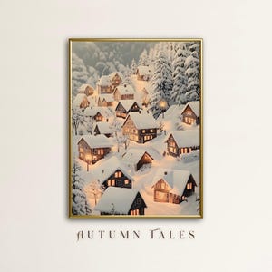 May include: A painting of a snowy village with small houses and trees. The houses are lit up with warm yellow lights, creating a cozy and festive atmosphere. The painting is framed in gold.