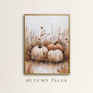May include: A painting of three white pumpkins in a field of brown and beige grasses and flowers. The pumpkins are arranged in a row, with the largest pumpkin in the center. The painting has a soft, muted color palette and a rustic feel.