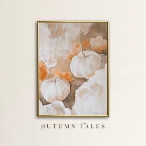 May include: A painting of two white pumpkins with orange leaves on a beige background. The painting is framed in gold and has the text "AUTUMN TALES" at the bottom.