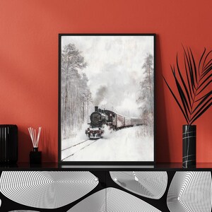 Capture the quiet beauty of winter with this enchanting wall art print featuring a lone train moving through a snow-blanketed field, surrounded by frosted trees. The soft, muted tones and serene landscape evoke a sense of cozy solitude.