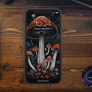 May include: A black iPhone with a dark background wallpaper featuring a pattern of red and white mushrooms. The time is 10:24 and the date is Tuesday, September 13.