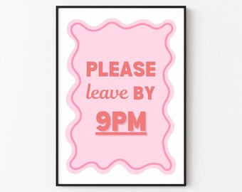 May include: Pink and white sign with a wavy border that says "PLEASE leave BY 9PM" in red text.