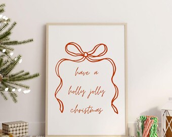 Może przedstawiać: Biały wydruk w ramie z czerwonym wzorem kokardki i tekstem "have a holly jolly christmas".