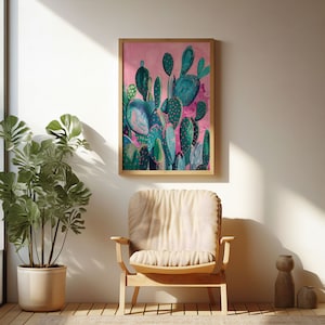 a painting hanging on a wall next to a chair and a potted plant