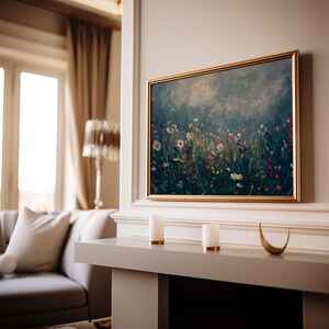 a living room with a couch and a painting on the wall