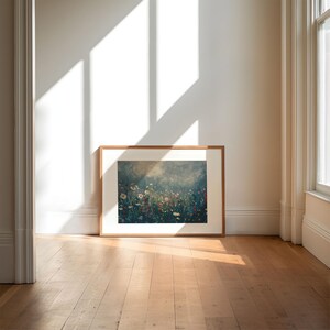 an empty room with a picture frame on the floor