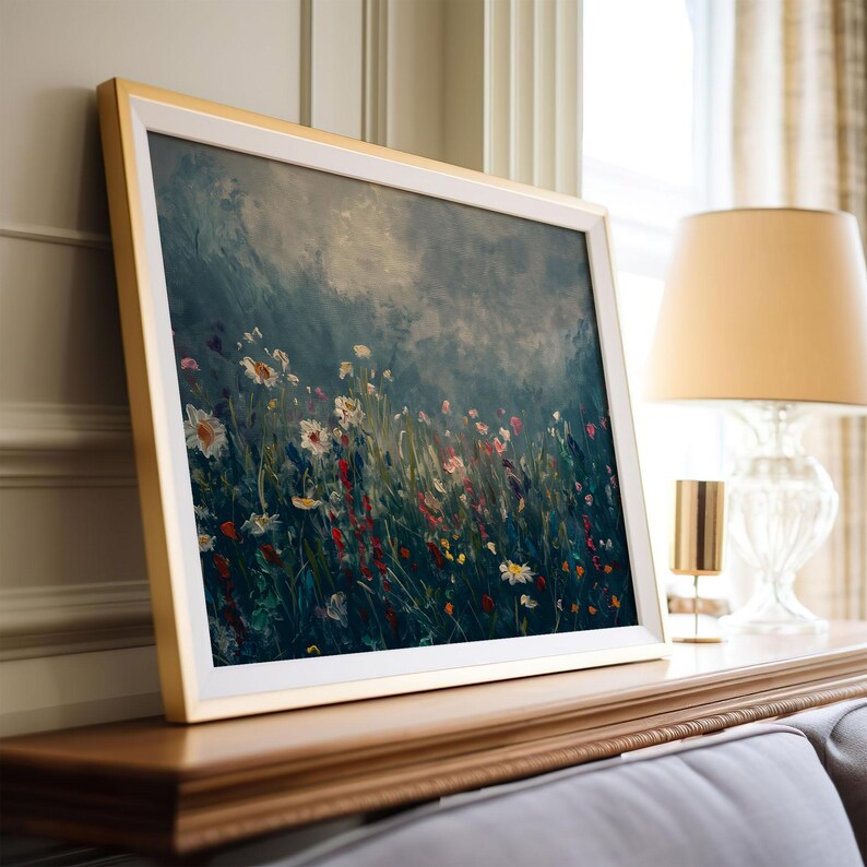 a picture of a painting on a mantle next to a lamp