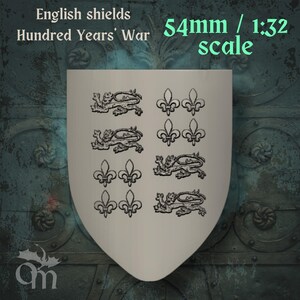 May include: A cream-colored shield featuring black heraldic designs of lions and fleur-de-lis. The text reads "English shields Hundred Years' War." The shield is 54mm in height at a 1:32 scale.