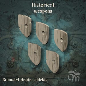 May include: Five wooden rounded heater shields with a central hole, set against a textured backdrop. The shields have a distressed, weathered look. The image includes the text "Historical weapons" and "Rounded Heater shields".