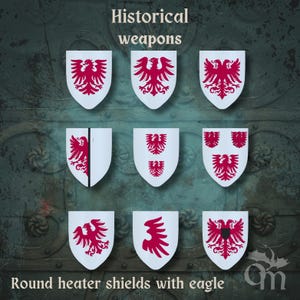 Puede incluir: Nueve escudos blancos redondos con diseños de águilas rojas. Los escudos están dispuestos en tres filas de tres. Se muestra el texto "Historical weapons" y "Round heater shields with eagle".