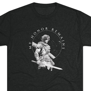 May include: Dark grey t-shirt with a black and white illustration of a warrior holding a sword, encircled by the text "MY HONOR REMAINS". The design features a detailed drawing of a figure in armour.