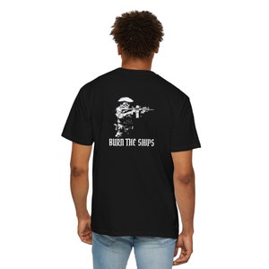 May include: Black t-shirt with a white graphic of a soldier holding a rifle and the text "BURN THE SHIPS".