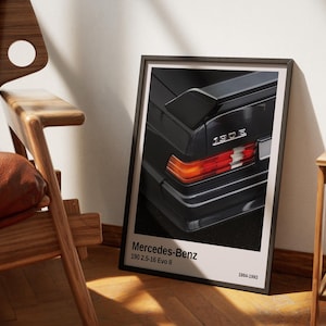 May include: A black and white poster featuring a close-up of the rear end of a black Mercedes-Benz 190 2.5-16 Evo II. The poster includes the text "Mercedes-Benz 190 2.5-16 Evo II 1984-1993".