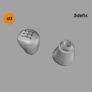 Può includere: Un modello 3D di una leva del cambio in argento con uno schema a 6 velocità. La leva è mostrata da due angolazioni diverse.