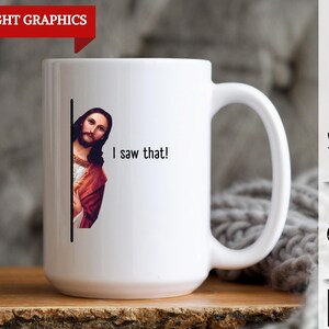 May include: White ceramic coffee mug with a black line down the side. A picture of Jesus is peeking around the line, with the text "I saw that!" printed below.