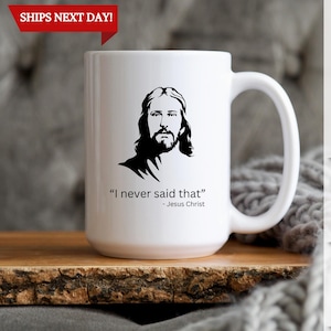 May include: White ceramic coffee mug with a black silhouette of Jesus Christ and the quote "I never said that" - Jesus Christ.