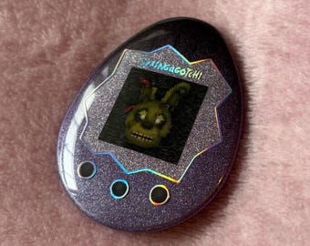 Springagotchi Animatronic Digital Pet Glitter Holographic Egg Badge